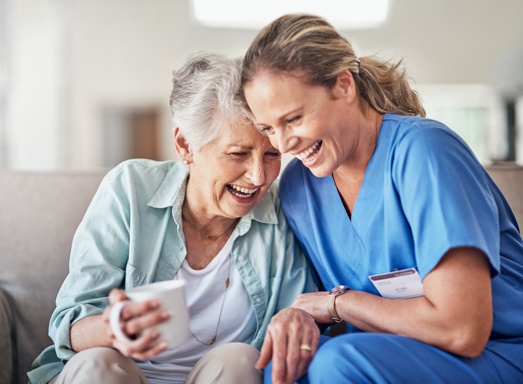 A caregiver sharing a joyful moment with a client