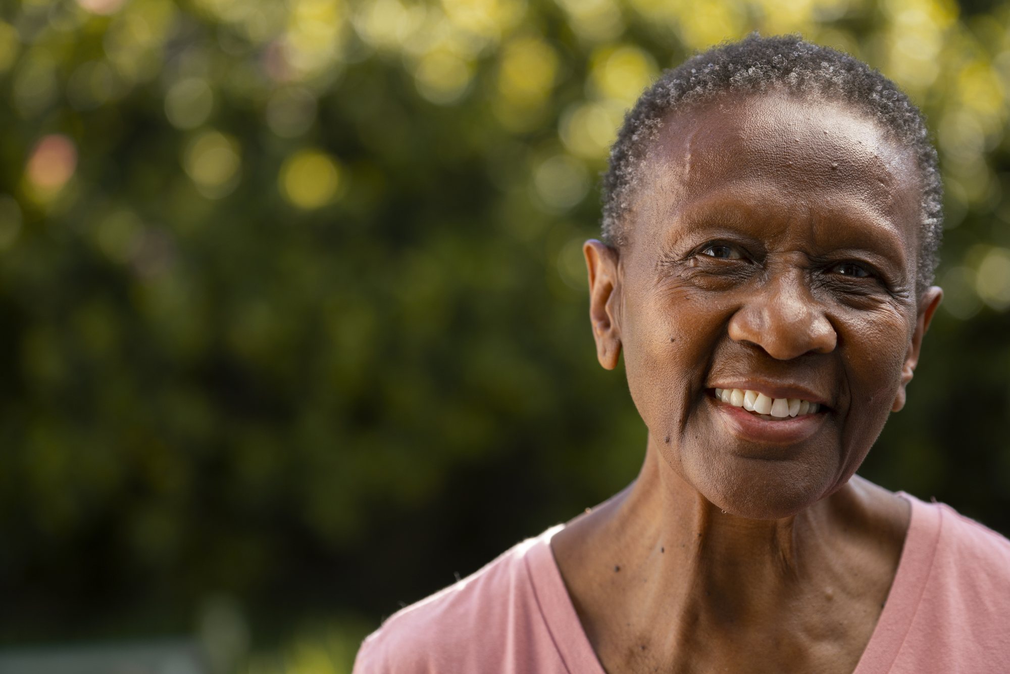 A smiling senior woman outdoors